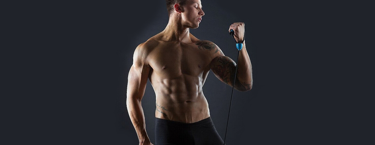 Motivated gym member using modern gym equipment