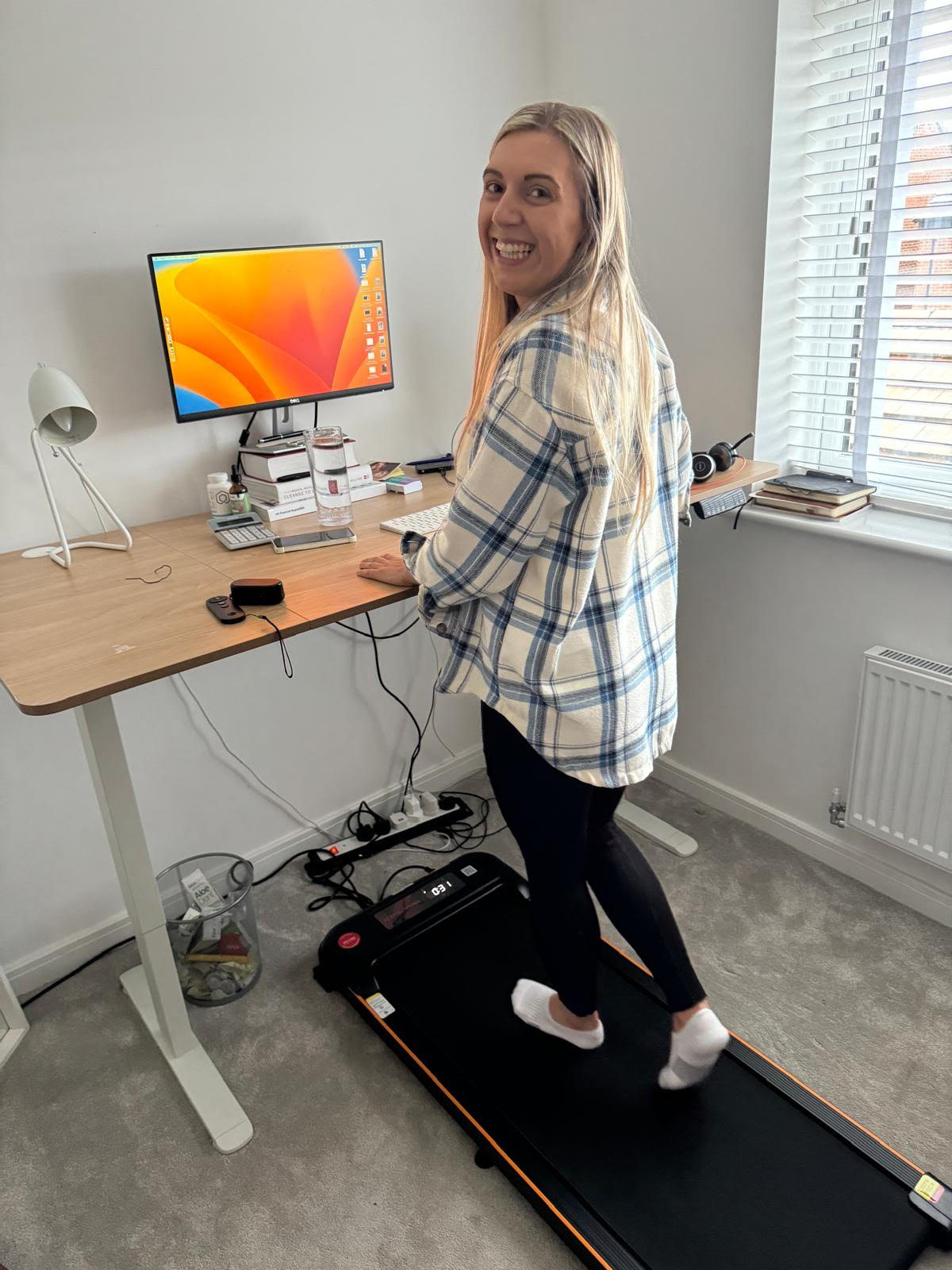 Client Laura in home office fitness setup
